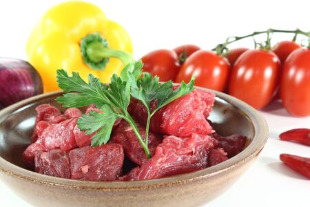 fresh beef Goulash with onions, tomatoes, peppers, parsley and chilliの写真素材