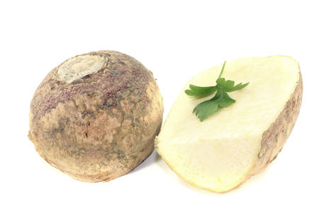 two rutabaga with parsley on a bright backgroundの写真素材