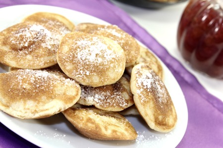 Poffertjes with powdered sugar and fruit jellyの写真素材