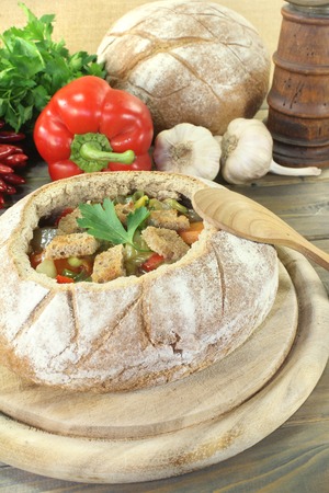 Bread soup with garlic, parsley, vegetables and croutonsの写真素材
