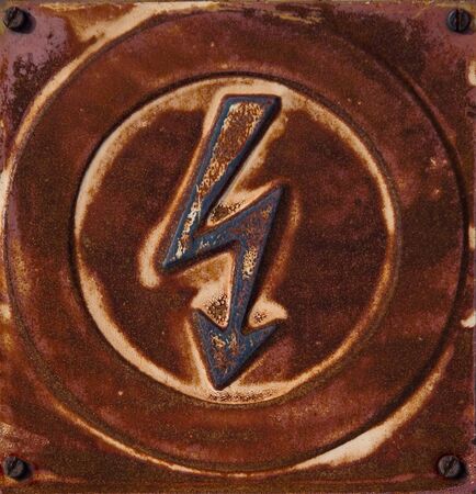 Rusty high voltage sign の写真素材