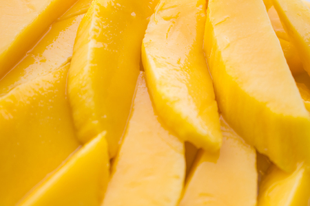 Background of unripe mango slices.の写真素材