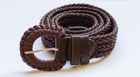 Belt rests  on a white background.の写真素材
