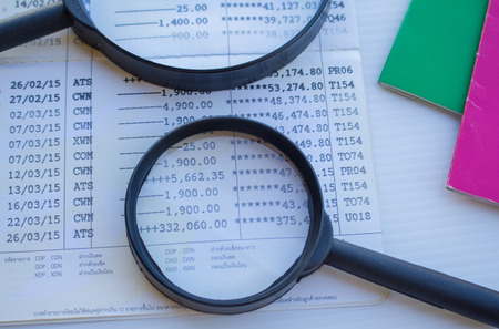 Magnifying glass and passbook for the future
