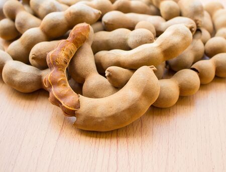 Sweet tamarind on wooden floorの写真素材