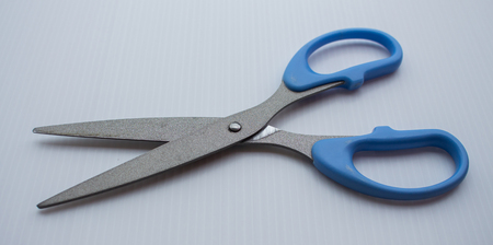 Blue scissors. Object is isolated on white backgroundの写真素材