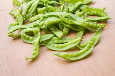 Fresh peas  green placed on wooden floorsの写真素材