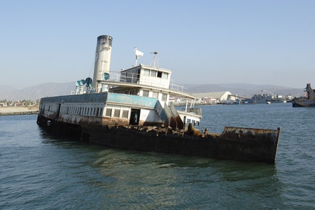 A group of sea lions are resting on an old abandoned ship in the bay of Ensenada in Mexico の写真素材