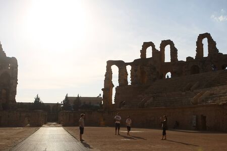 EL DJEM  TUNISIA - September 17   Silhouette of arches of roman biggest amphitheater in Africa, with tourists who are taking photos of amphitheater, on September 17, 2012  in El Djam, Tunisiaのeditorial素材