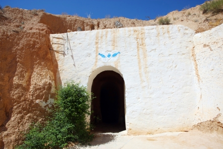 Matmata, Tunisia  The largest region of the troglodyte communities  One of many dwellings - fragment of courtyard excavated in the rock  circular crater a few meters deep  on September 17, 2012 in Matmata, Tunisia  Door entrance in one of the rooms のeditorial素材