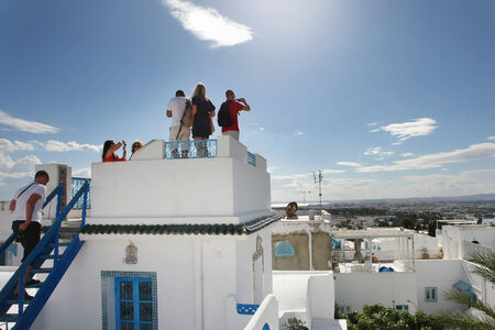 Sidi Bou Said, Tunisia - September 14th, 2012   Tourists photographing the view of the city from the...