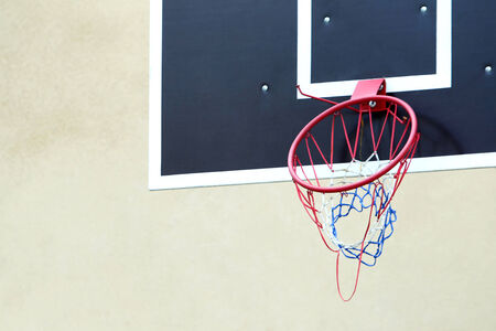 A close up of a broken basketball hoop at playground.の写真素材