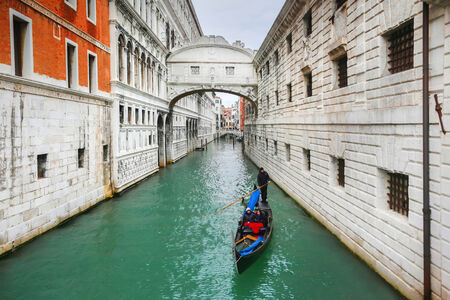 VENICE, ITALY - FEBRUARY 15 : A view of a gondola passing under The Bridge of Sighs (Ponto dei Sospiri) on February 15, 2014 in Venice, Italy. Ponto dei Sospiri passes over the Rio di Palazzo and connects the Dogeのeditorial素材