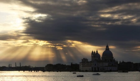 A view of the cloudscape over the Santa Maria della Salute church at sunset in Venice,Italy.の写真素材