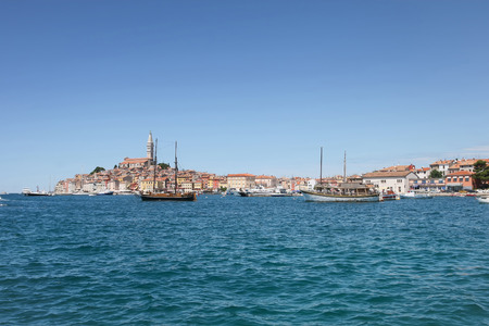 ROVINJ CROATIA  JULY 26 : Ships anchored in the Adriatic sea and the old city core with the Saint Euphemia church in the background on July 26th 2009 in Rovinj Croatia. Rovinj is a popular tourist destination on the Adriatic coast in Croatia.のeditorial素材