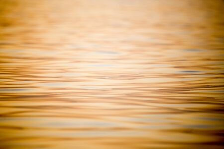 An abstract of the sea water surface at sunset.の写真素材