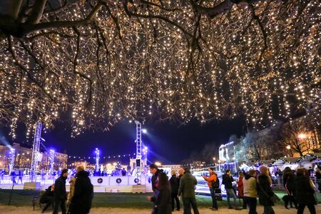 ZAGREB, CROATIA - DECEMBER 10: People walking in front of the ice skating rink at Advent time in King Tomislav Park on December 10th, 2015 in Zagreb, Croatia. Zagreb has been declared the best european christmas destination in 2015.のeditorial素材
