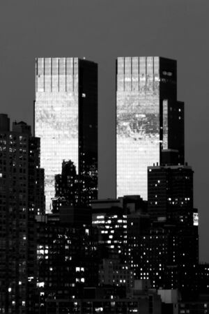 The Time Warner Center twin tower office building with residential skyscrapers in Midtown Manhattan at night in New York City, USA.のeditorial素材