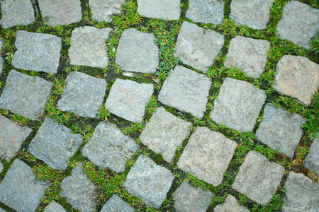 A directly above view of a stone floor with grass.の写真素材