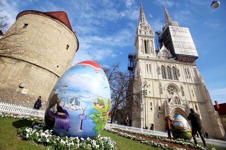 ZAGREB,CROATIA - MARCH 26, 2016 : Three easter eggs painted with technique naive by hand are placed...