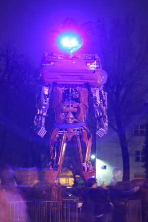 ZAGREB, CROATIA - MARCH 27, 2016 : People visiting exhibition at night by Danilo Baletic named Transformers protecting Zagreb in Zagreb,Croatia. Exhibition is made of automobile parts and waste.のeditorial素材