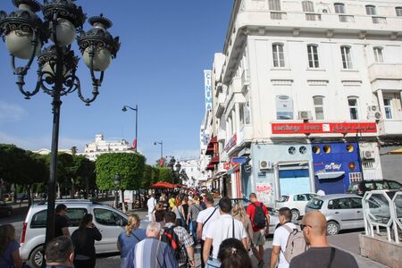 TUNIS, TUNISIA - SEPTEMBER 14, 2012 : People walking in Avenue Habib Bourguiba in Tunis,Tunisia.のeditorial素材