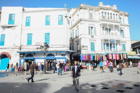 TUNIS, TUNISIA - SEPTEMBER 14, 2012 : People walking in the city square Place de la Victoire, at the beginig of Medina, famous marketplace in Tunis, Tunisia.のeditorial素材