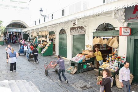 TUNIS, TUNISIA - SEPTEMBER 14, 2012 : People walking in the streets with shops of Medina, famous marketplace in Tunis,Tunisia.のeditorial素材