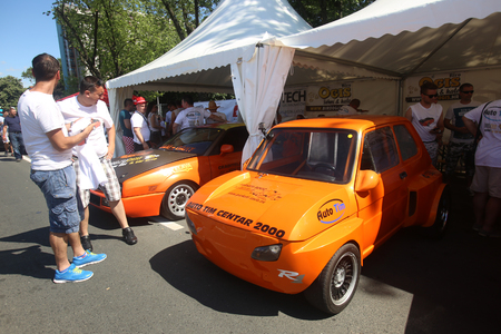 ZAGREB, CROATIA - JUNE 4, 2016 : People sightseeing lined up parked cars that are waiting for the start of a race at Fast and furious street race at Avenue Dubrovnik in Zagreb, Croatia.のeditorial素材