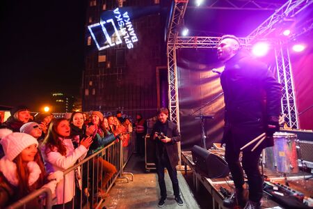 ZAGREB, CROATIA - DECEMBER 1th, 2016: Advent time in city center of Zagreb, Croatia. Famous croatian rock band Vatra performing on stage in front of audience in the upper old town.のeditorial素材