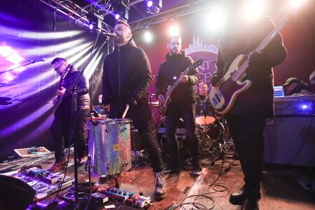ZAGREB, CROATIA - DECEMBER 1th, 2016: Advent time in city center of Zagreb, Croatia. Famous croatian rock band Vatra performing on stage in front of Art gallery Klovicevi Dvori in the upper old town.のeditorial素材