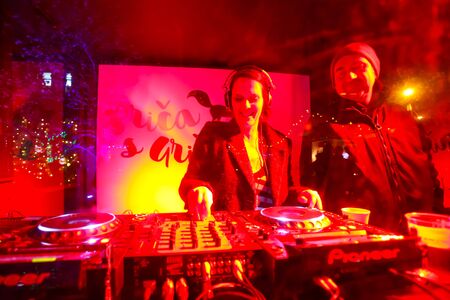 ZAGREB, CROATIA - DECEMBER 1th, 2016: Advent time in city center of Zagreb, Croatia. Two djs playing music in a dj booth in the upper old town Gradec.のeditorial素材
