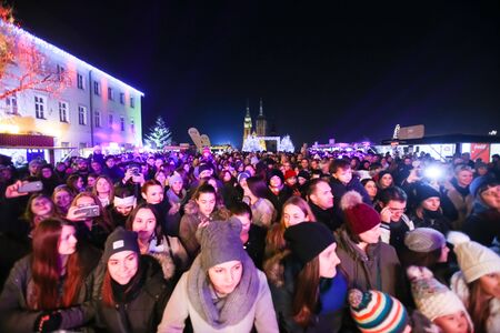 ZAGREB, CROATIA - DECEMBER 1th, 2016: Advent time in city center of Zagreb, Croatia. The audience at the famous croatian rock band Vatra concert in front of Art gallery Klovicevi Dvori in the upper old town.のeditorial素材