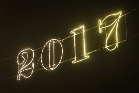 A 2017 illuminating decoration sign on a wire.の写真素材