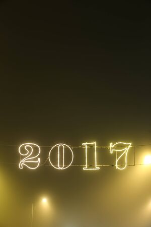 A 2017 illuminating decoration sign on a wire.の写真素材