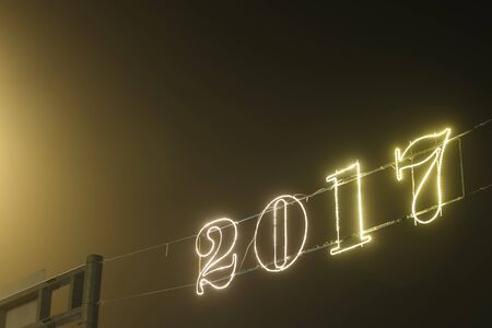 A 2017 illuminating decoration sign on a wire.の写真素材