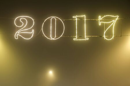 A 2017 illuminating decoration sign on a wire.の写真素材