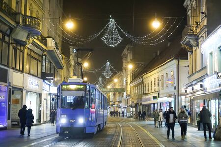 ZAGREB, CROATIA - DECEMBER 23rd, 2016: People walking down the Ilica street decorated with Christmas decoration at Advent time in Zagreb, Croatia.のeditorial素材