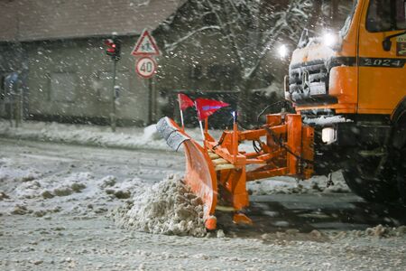 VELIKA GORICA, CROATIA - JANUARY 13th, 2017 : Snowplow cleaning streets in the aggravated traffic due to strong snowfall in Velika Gorica, Croatia.のeditorial素材