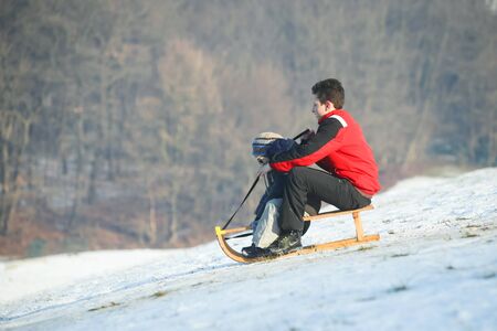 ZAGREB, CROATIA - JANUARY 15, 2017 : Two boys sledding down the hill at winter time in Zagreb, Croatia.のeditorial素材