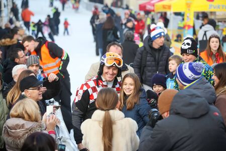 ZAGREB, CROATIA - JANUARY 15, 2017 : FIS World Snow Day for kids with free skiing and snowboarding lessons on the ski slope in Bakaceva street, on the road from the cathedral to the main square. Ivica Kostelic posing with kids.のeditorial素材