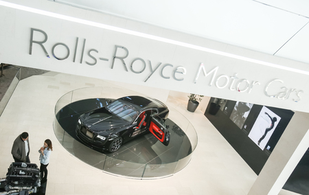 MUNICH, GERMANY - MAY 6, 2017 : People sightseeing the exhibited Rolls Royce automobile in the BMW...