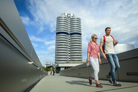 MUNICH, GERMANY - MAY 6, 2017 : People walking on the bridge connecting the BMW Museum with the BMW Welt exhibition center in Munich, Germany.のeditorial素材
