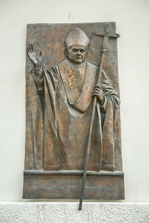 FREISING, GERMANY - MAY 8, 2017 : A wall sculpture of Pope Benedict XVI on Saint Mary and Corbinian Cathedral  in Freising, Germany.のeditorial素材