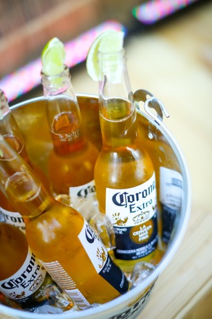 ZAGREB, CROATIA - JUNE 28, 2017 : A Corona bowl full of Corona Extra beer bottles on the Corona Sunsets Session party on the roof of Zagreb Dance Center in center of Zagreb, Croatia.のeditorial素材