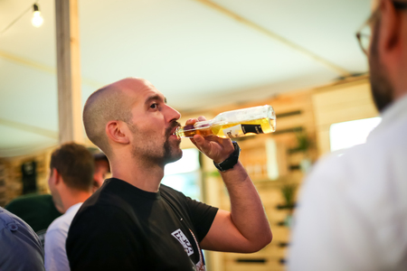 ZAGREB, CROATIA - JUNE 28, 2017 : Famous Croatian radio host Daniel Bilic drink Corona beer on the...