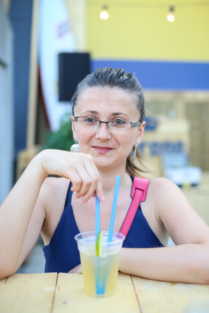 ZAGREB, CROATIA - JUNE 28, 2017 : Woman drinking Corona cocktail on the Corona Sunsets Session party on the roof of Zagreb Dance Center in center of Zagreb, Croatia.のeditorial素材