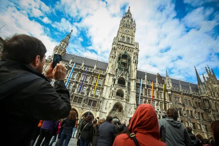 MUNICH, GERMANY - MAY 9, 2017 : People sightseeing the New Town Hall at Marienplatz in Munich, Germany.のeditorial素材