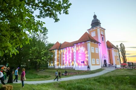 LUKAVEC, CROATIA - MAY 27, 2017 : People are visiting the Lukavec castle at sunset on the  Perunfest, festival of forgotten tales and folk tales held at Lukavec Castle in Lukavac, Croatia.のeditorial素材