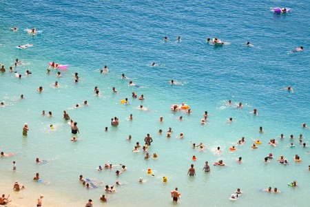 NEUM, BOSNIA AND HERZEGOVINA - JULY 16, 2017 : A view of people swimming and sunbathing on the town beach in Neum, Bosnia and Herzegovina.のeditorial素材